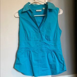 Blue sleeveless button down dress shirt